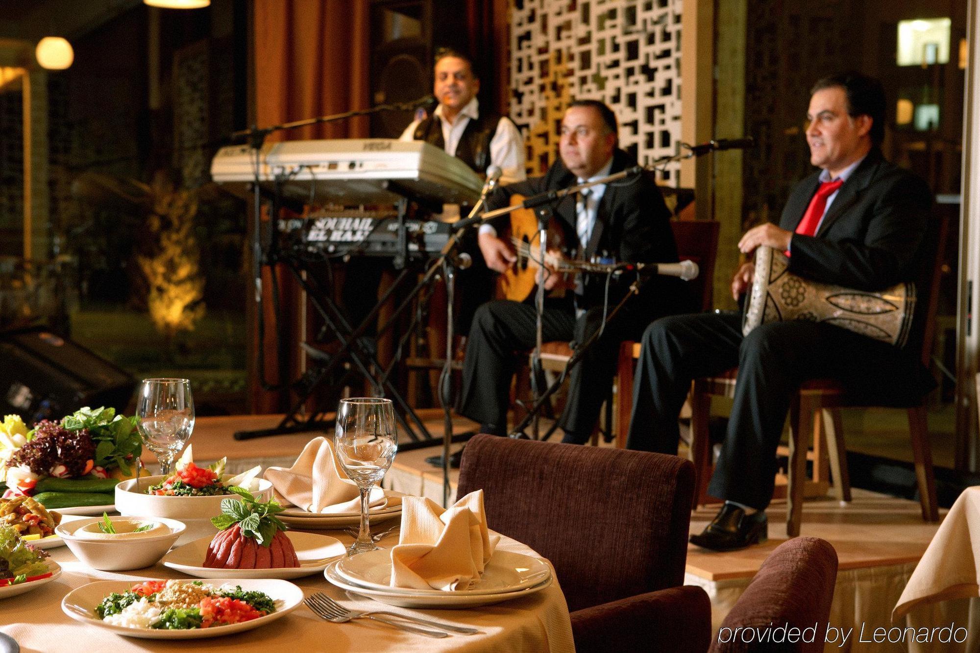 Готель Erbil Rotana Ресторан фото